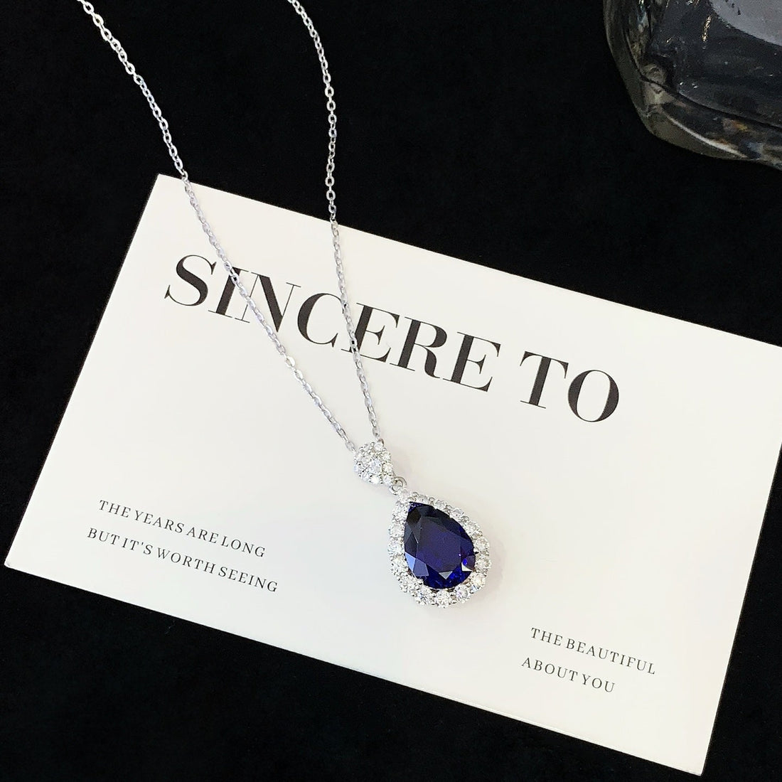 Pear Blue Sapphire Halo Pendant Necklace
